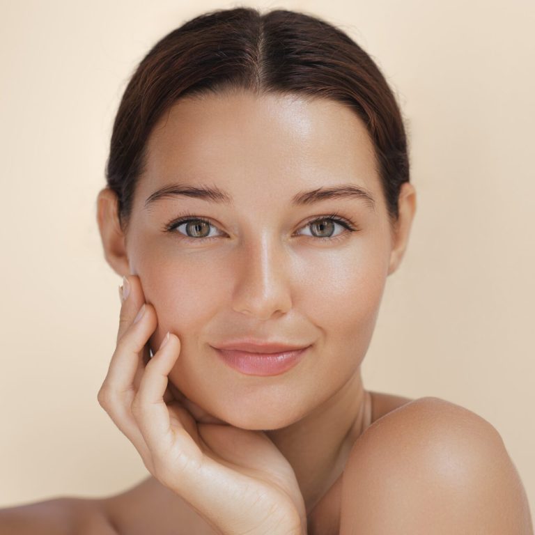 Close-up,Portrait,Of,A,Woman,With,Radiant,,Glowing,Skin,Gently